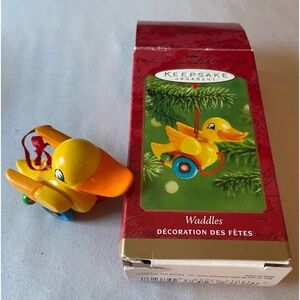Hallmark 2001 Waddles wooden duck ornament. Box has wear. Ornament excellent.